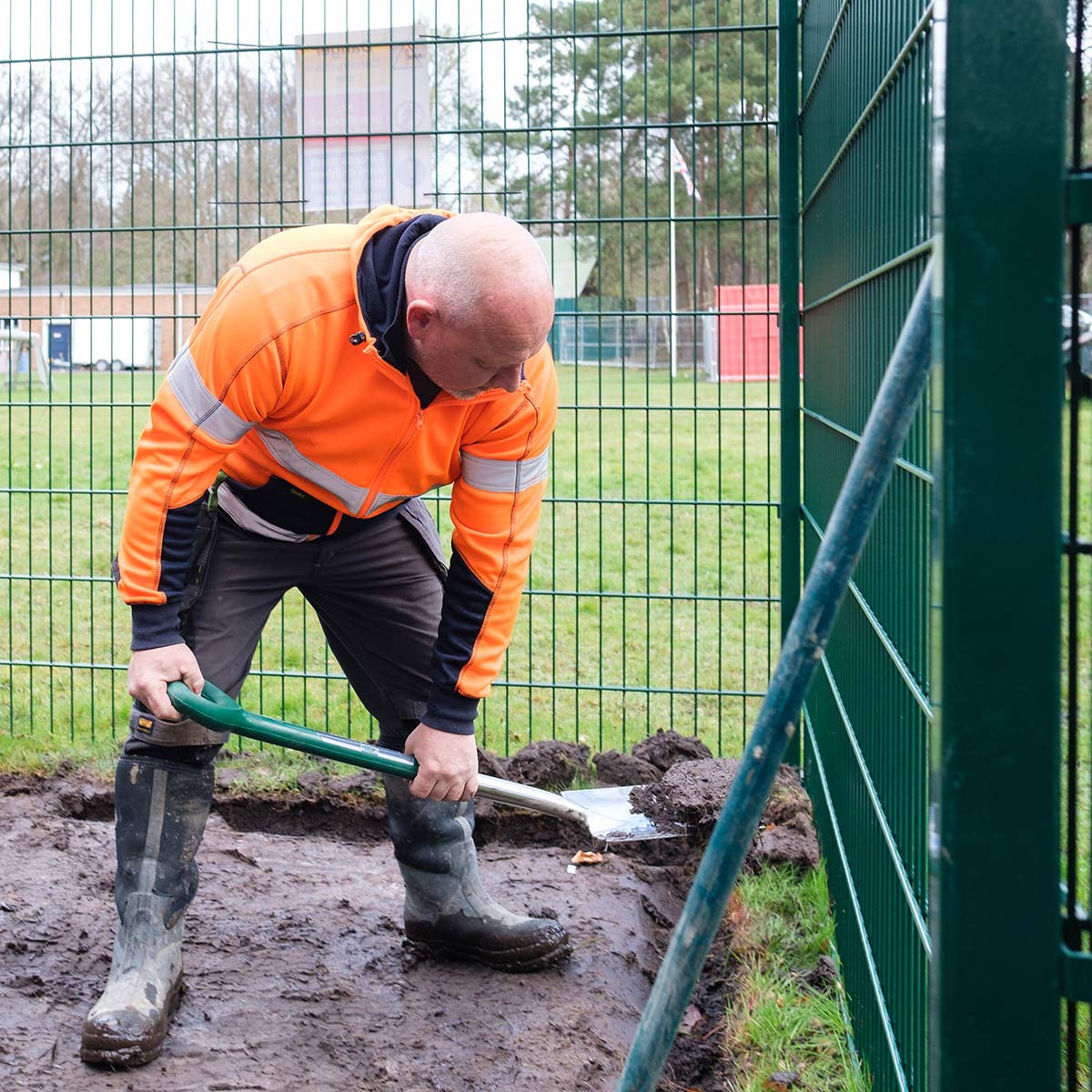 Lee working on a bow top fencing