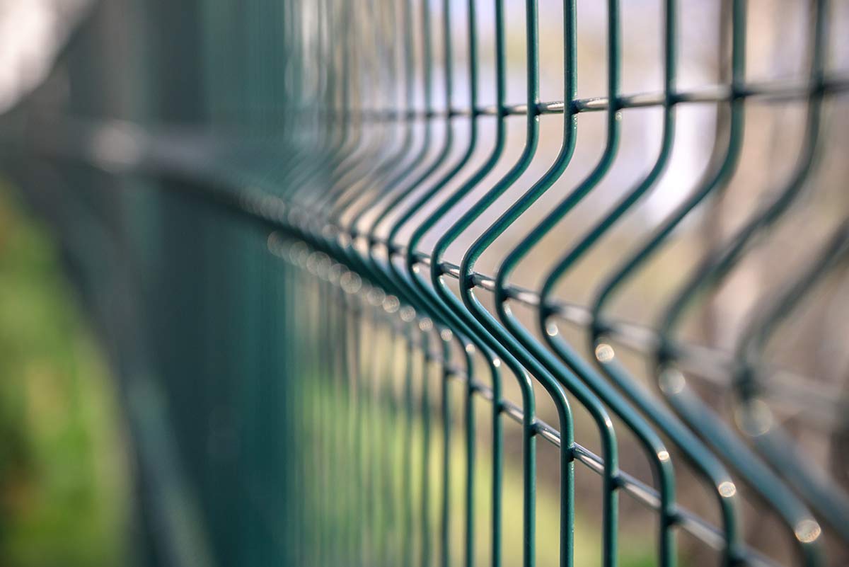 Close-up of green wire fencing